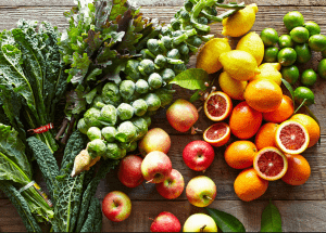 a group of fruits and vegetables on a wood surface Healthy Weight Loss Diets Haverhill