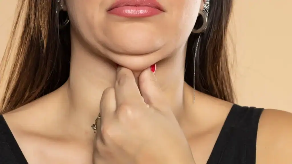 An image of a woman with double chin, sad, worried : Non Surgical Double Chin Removal Treatment in Haverhill, UK